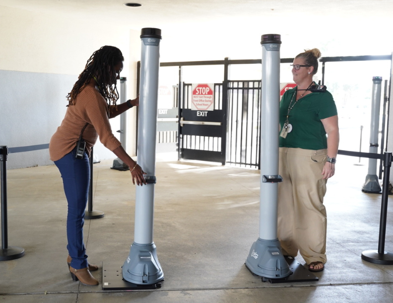 Teachers setting up OPENGATE at school entrance.